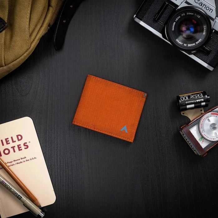 Beads of water on the ALLETT Sport Wallet in RFID-blocking nylon (Potter’s Clay) show its water-resistant, ripstop fabric and minimalist design.