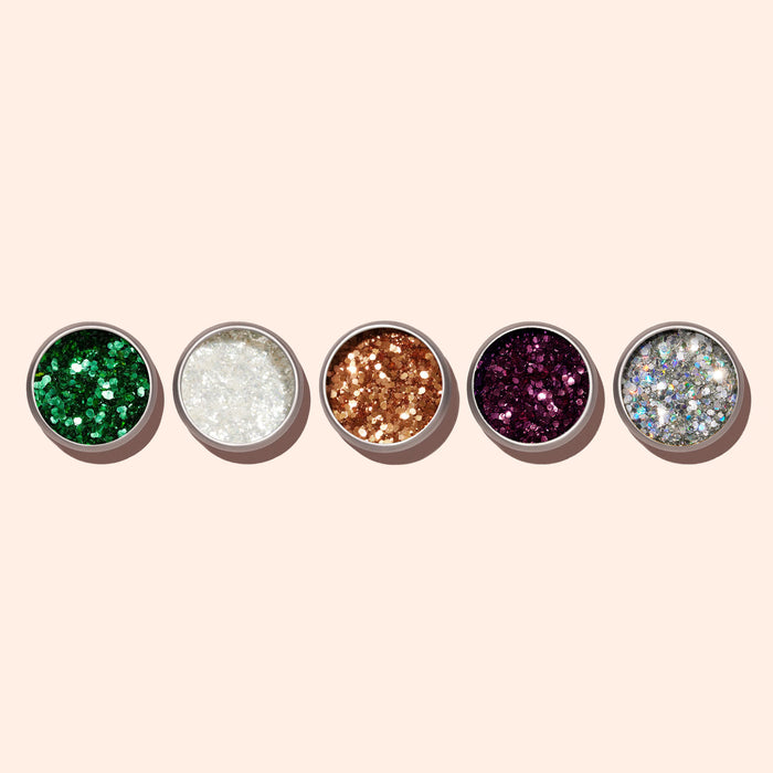 Five round containers of Manucurist Copper Biodegradable Glitter arranged on a light beige background—perfect for adding eco-friendly sparkle and creativity to your next manicure.