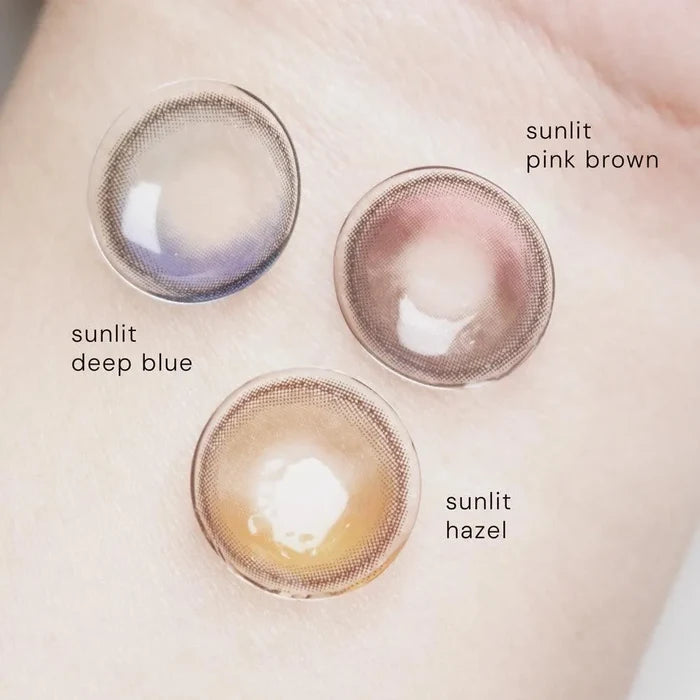 Color palette of EyeCandys Sunlit contact lenses showing various shades in Deep Blue, Pink Brown and Hazel