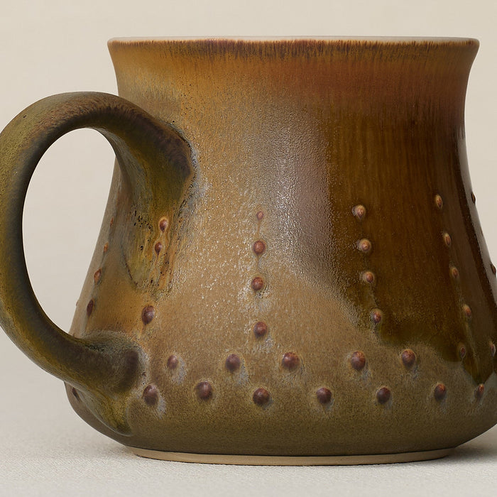 Close-up details of hand-thrown mug by Rookwood
