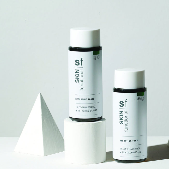 SKIN Functional Hydrating Tonic with details skincare product on a light gray background
