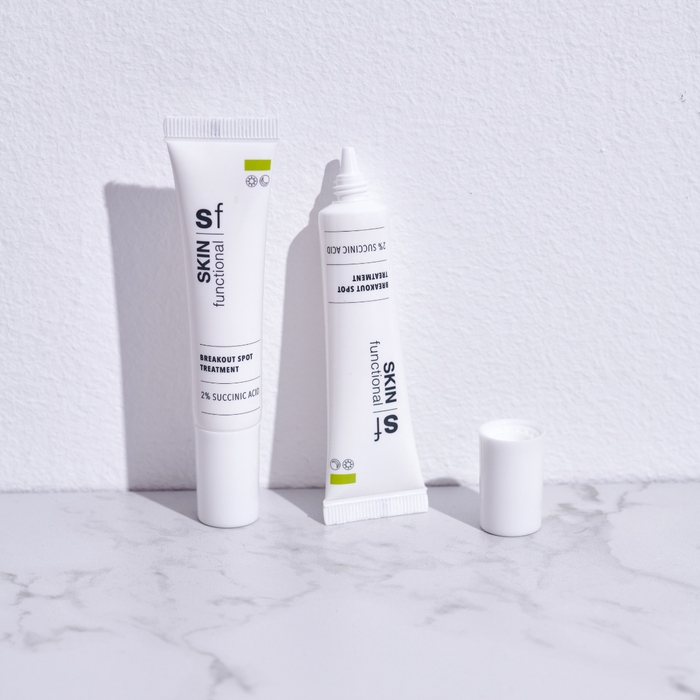 SKIN Functional Breakout Spot Treatment with product details skincare product on a light gray background