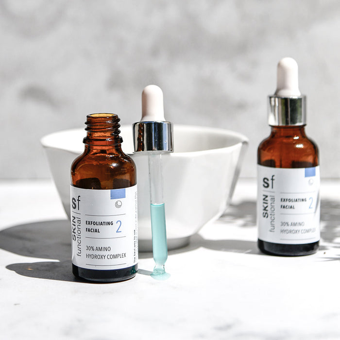SKIN Functional exfoliating facial treatment with details skincare product on a grey background