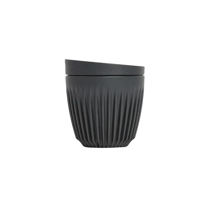 Black ribbed cup on a white background