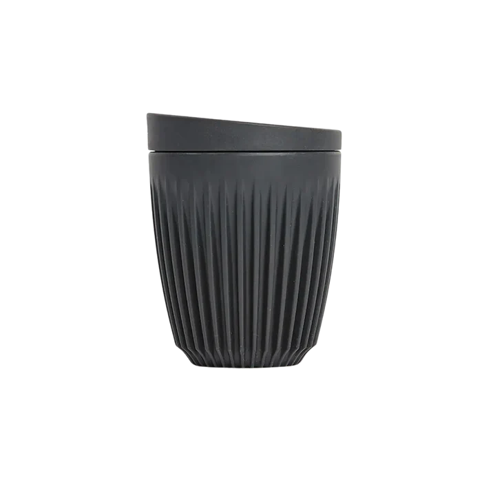 Black textured tumbler on a white background