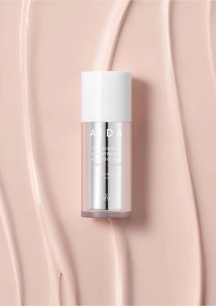 Skincare bottle with 'ALDA' branding on a pink background