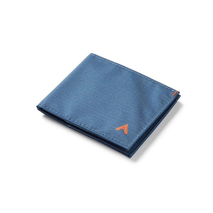 The ALLETT Sport Wallet in RFID-blocking indigo blue nylon features a minimalist design with an orange triangular logo on the corner, shown against a white background.