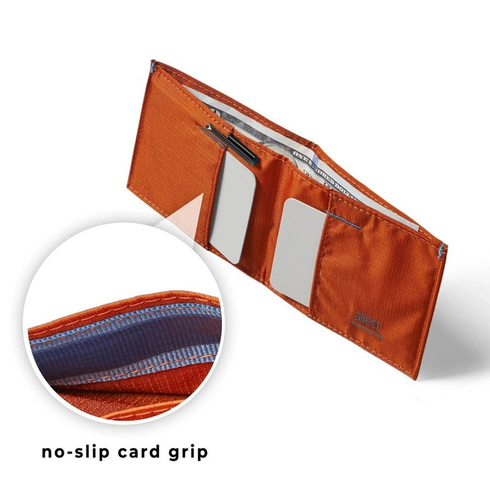 Beads of water on the ALLETT Sport Wallet in RFID-blocking nylon (Potter’s Clay) show its water-resistant, ripstop fabric and minimalist design.
