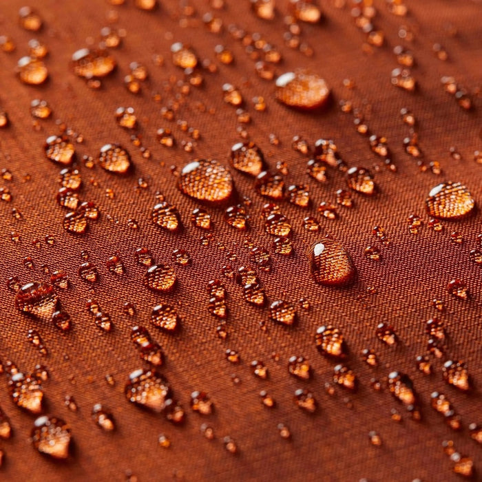 Beads of water on the ALLETT Sport Wallet in RFID-blocking nylon (Potter’s Clay) show its water-resistant, ripstop fabric and minimalist design.