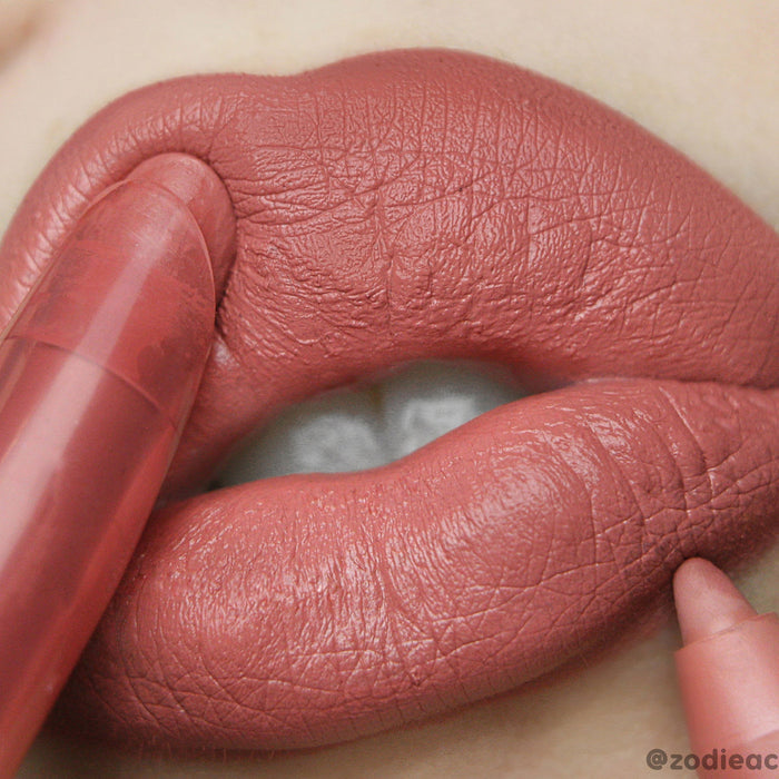 Another Round Lippie Pencil defining full lips in a warm rose-mauve shade, the creamy ColourPop Lippie Pencil gliding along the lip line for precise definition and allover fill with a soft matte finish, beauty close-up product swatch.