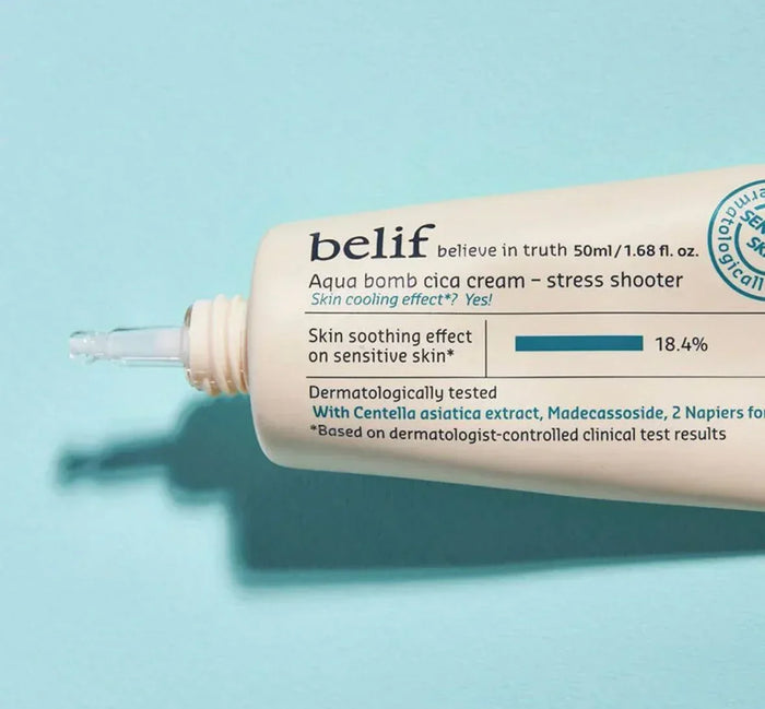 Close-up of Belif Aqua Bomb Cica Cream tube for sensitive skin on a light blue background