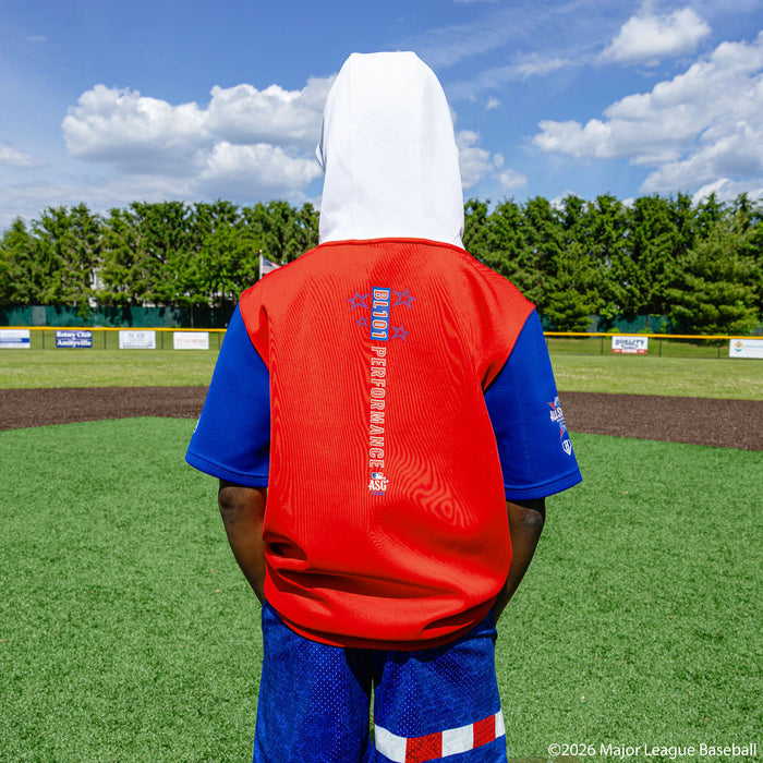 Youth model wearing Red, White & Blue youth short sleeve hoodie with "BL101 All-Star BSBL-SZN V3" design
