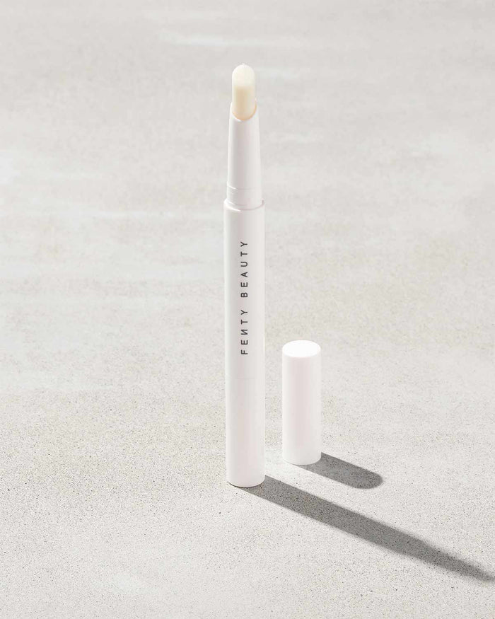 Brow MVP Sculpting Wax Pencil standing upright with the cap off and the brow wax twisted up.