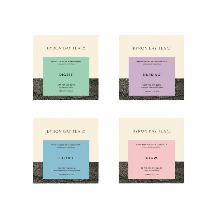 Four Byron Bay Tea Co. tea bags with different flavors on a white background