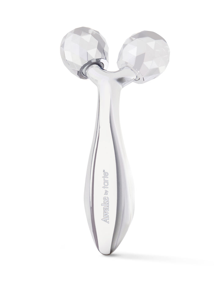 Silver facial roller with brand name on a white background