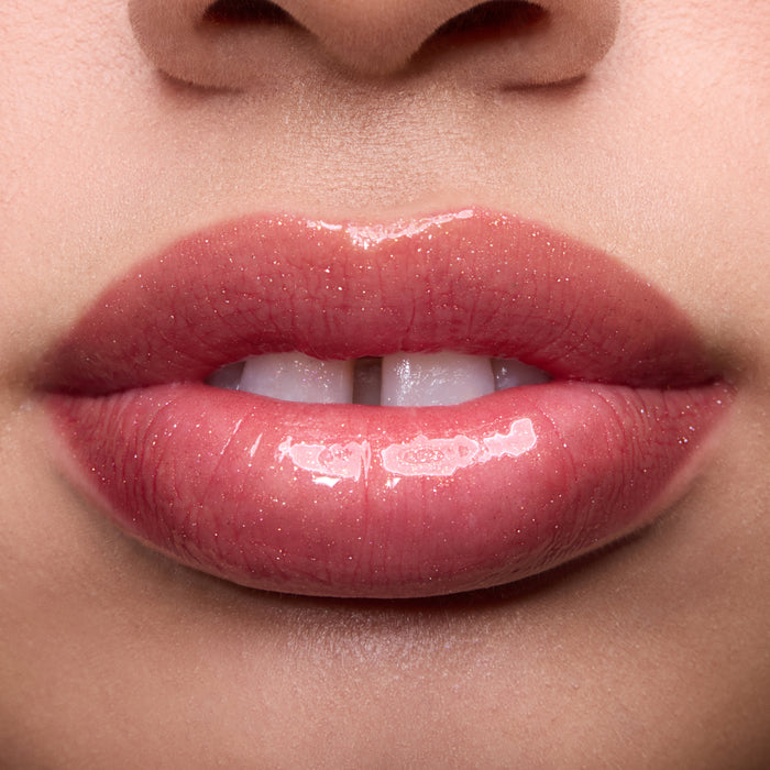Close-up swatches of Colourpop Fresh Kiss Glossy Balm in Chocolate Cherry on lip tones, showing sheer berry shine with subtle shimmer, promoting Lip Gloss & Lip Oil finish and smooth, hydrated lips.