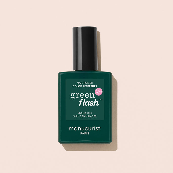 Manucurist's Color Refresher is a quick dry shine enhancer nail polish with a dark green label and black cap—ideal for speedy touch-ups and extending your manicure's life, displayed on a pale beige background.