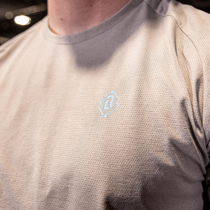 athlete wearing gray performance shirt