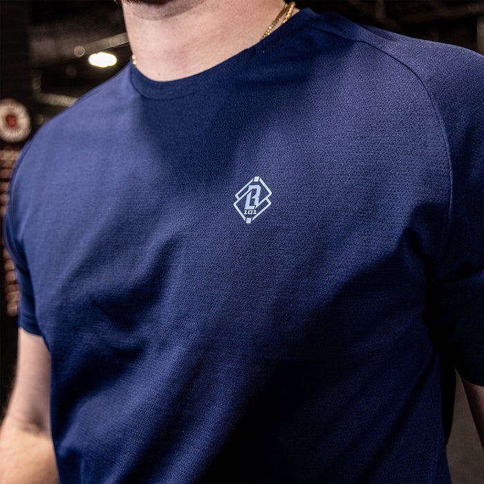 athlete wearing navy athletic shirt