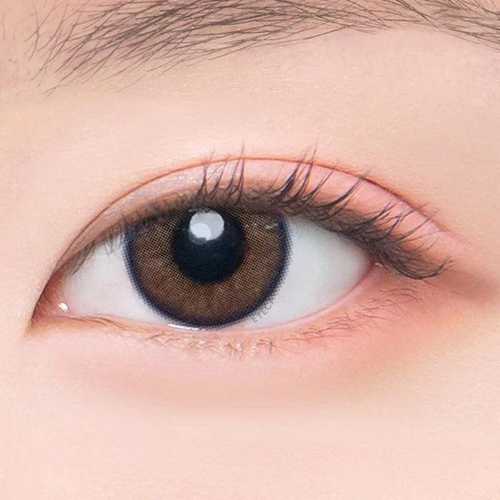 Macro shot of an eye wearing the DooNoon I On Brown prescription colour contact lens, showing the multi-colored detail and natural effect on dark brown eyes.