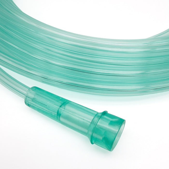 Coiled green plastic tube with a connector on a white background