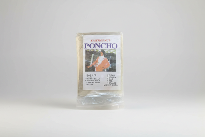 Emergency poncho packaging with a person wearing a poncho on the label.