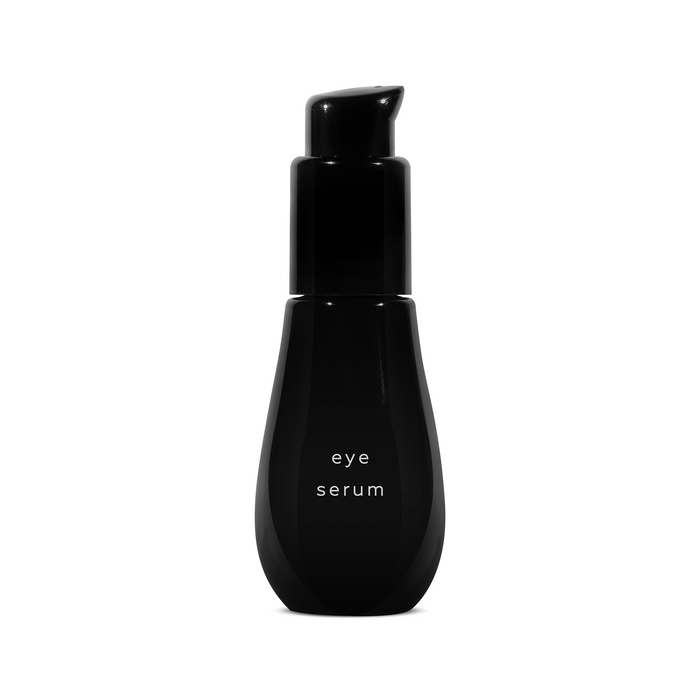 A front product shot of a glossy black Ayuna Eye Serum pump bottle, showcasing its sleek, minimalist organic silhouette.