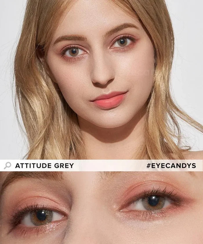 A woman with light blonde hair wears natural makeup and EyeCandys Attitude Glitter Grey colored contacts. The close-up highlights the contacts’ high water content. Text: "ATTITUDE GREY" and "#EYECANDYS".