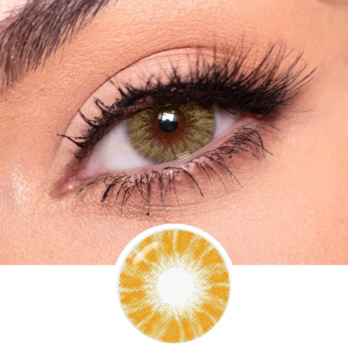 Close-up of an eye with long lashes wearing EyeCandys Shade Brown contact lenses. Below, a circular image showcases the detailed pattern and vibrant color of these EyeCandys brown colored contacts.