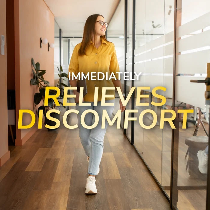Flat Feet Support Insoles for Women by DrScholls showing a woman walking comfortably through an office to relieve foot discomfort and support daily movement