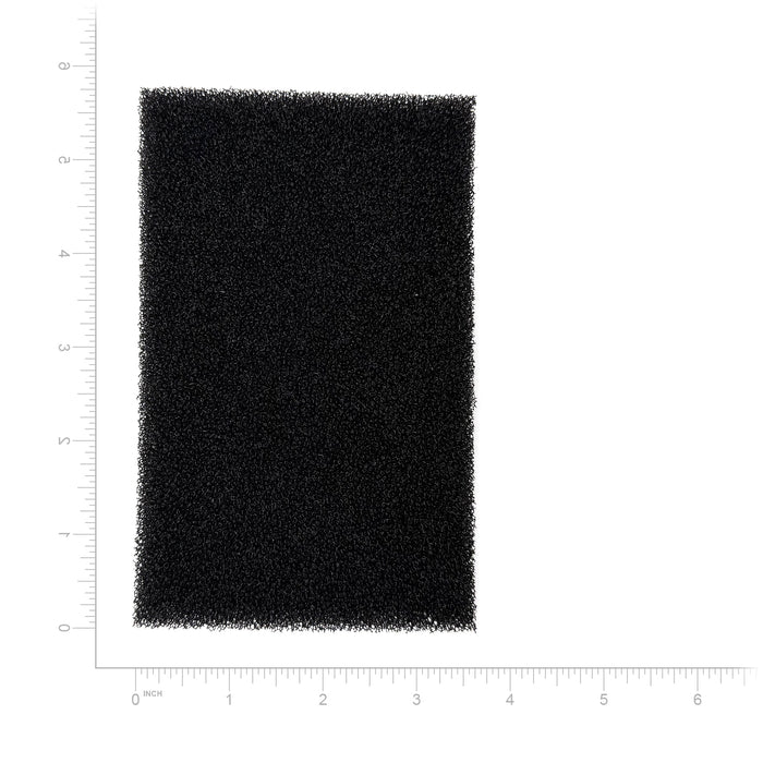 Rectangular black foam filter with measurement scale on a white background