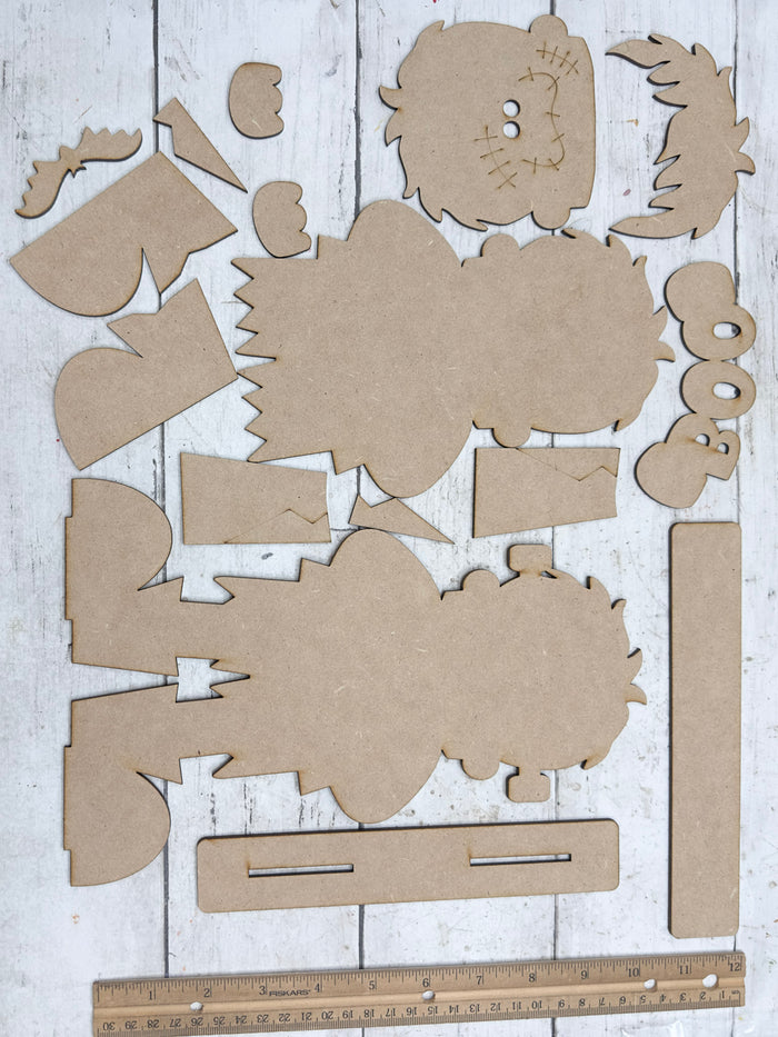 Unassembled Frankenstein BOO Shelf Sitter DIY Kit pieces displayed beside a ruler