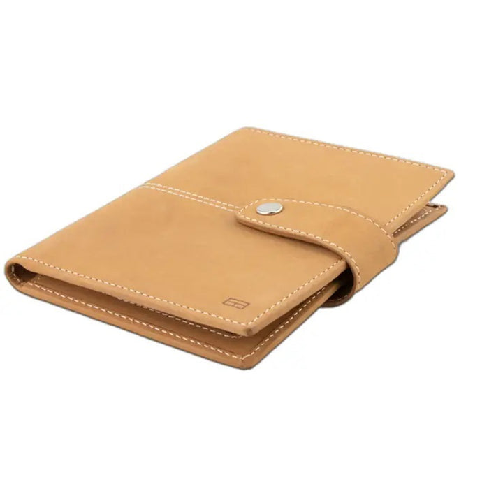 The GARZINI RFID-blocking leather passport holder in camel brown features white stitching and a circular front compartment for an Apple AirTag.