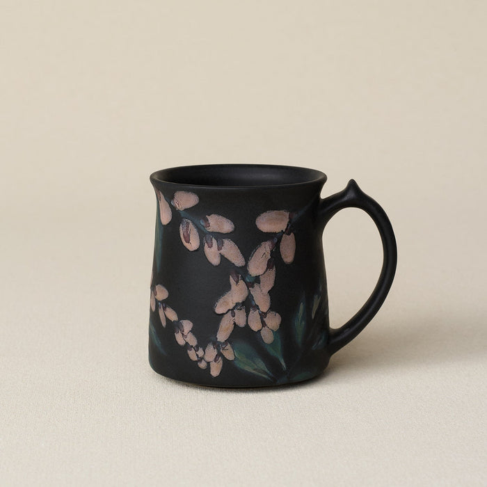 Hand-thrown ceramic mug by Rookwood Pottery