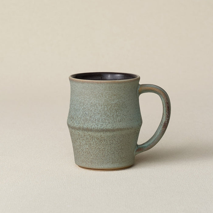 Hand-thrown ceramic mug by Rookwood Pottery