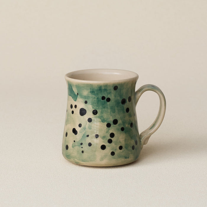 Hand-thrown ceramic mug by Rookwood Pottery
