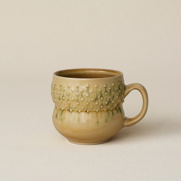 Hand-thrown ceramic mug by Rookwood Pottery