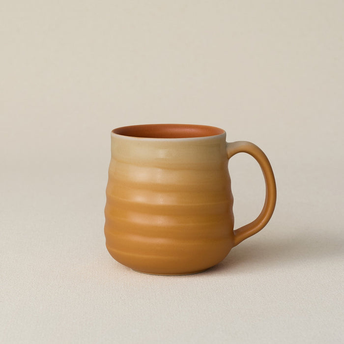 Hand-thrown ceramic mug by Rookwood Pottery