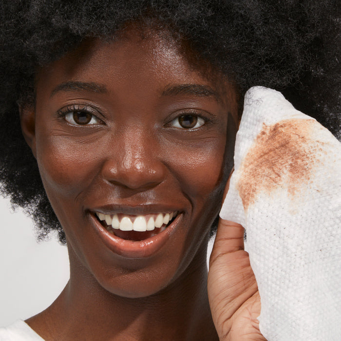 Model showing makeup on face wipe that came off when she used it.