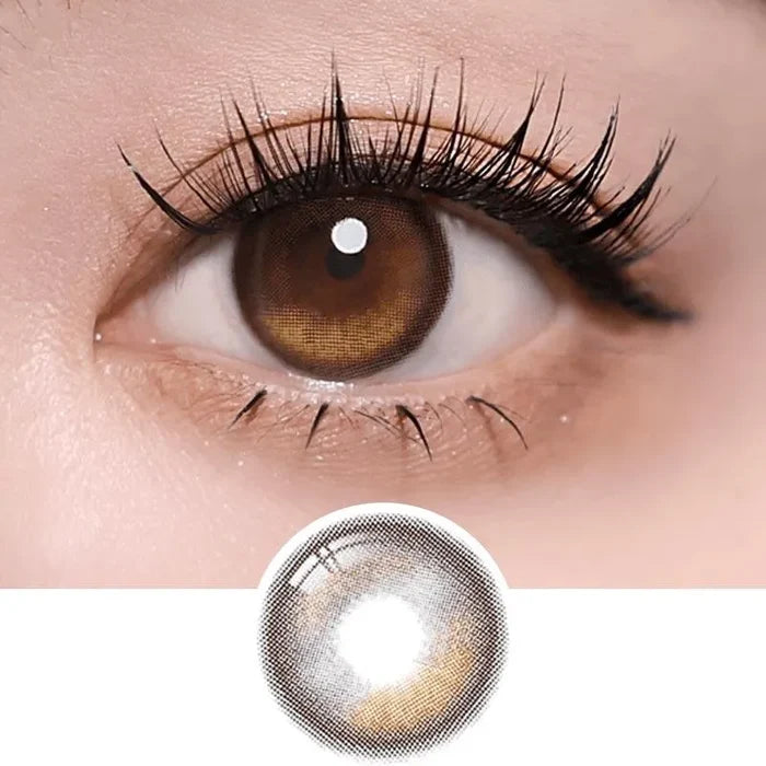Macro shot of an eye wearing the i-Sha Oriana Edge Plus 1-Day Shade Brown (10pk) prescription colour contact lens, showing the multi-colored detail and natural effect on dark brown eyes, with clean eye makeup. At the bottom is the pattern of the colored lens design, showing the dotted detail and pigmentation.