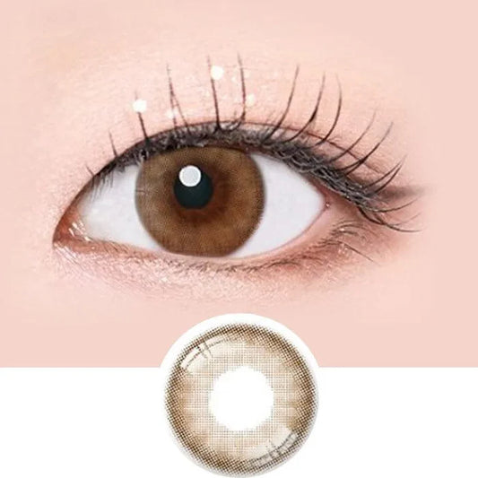Macro shot of an eye wearing the i-Sha Serenity Brown prescription colour contact lens, showing the multi-colored detail and natural effect on dark brown eyes, with clean eye makeup. At the bottom is the pattern of the colored lens design, showing the dotted detail and pigmentation.