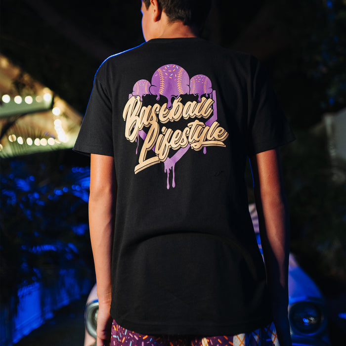 Youth model wearing black Ice Cream Cosmic Cone Crunch youth graphic tee