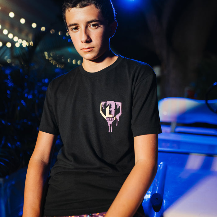 Youth model wearing black Ice Cream Cosmic Cone Crunch youth graphic tee