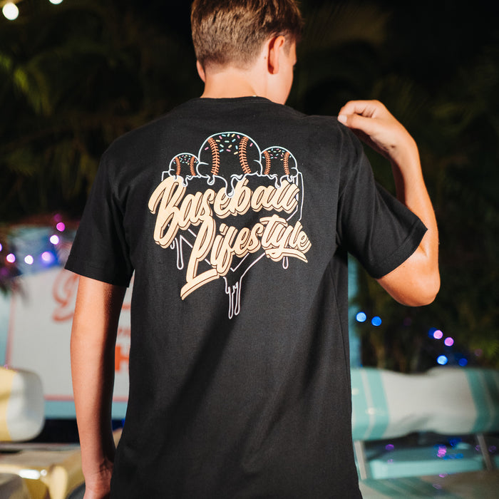 Youth model wearing black Ice Cream Midnight Sundae youth graphic tee