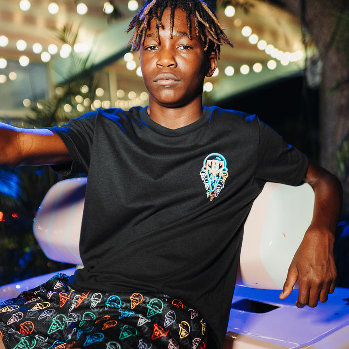 Youth model wearing black Ice Cream Scoops youth graphic tee