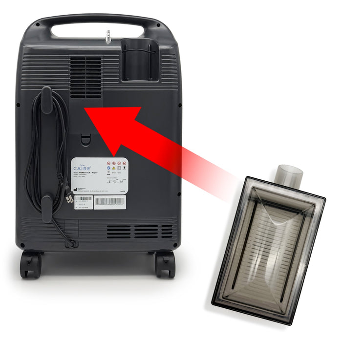 Black oxygen concentrator with visible branding on a white background with red arrow to where the inlet filter is placed