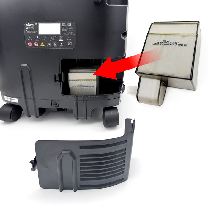 Black machine with a red arrow pointing to a filter, showing how to replace it.