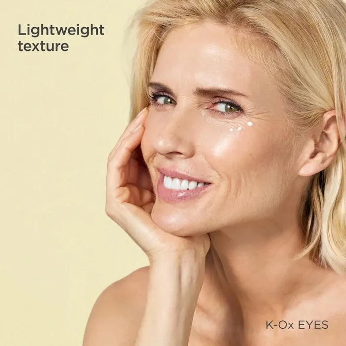 Blonde woman applying K-Ox Eyes brightening eye contour cream, lightweight texture