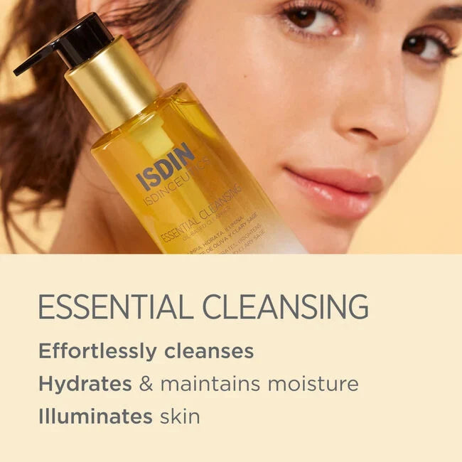 ISDIN Isdinceutics Essential Cleansing oil-to-milk cleanser bottle with gold pump, text reads "ESSENTIAL CLEANSING"