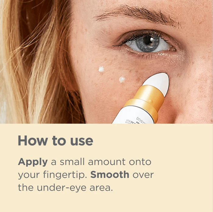 Woman applying ISDIN K-Ox Eyes cream under eye; how to use: apply small amount, smooth over under-eye area